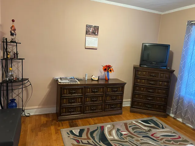 a bed room with a bed and a television