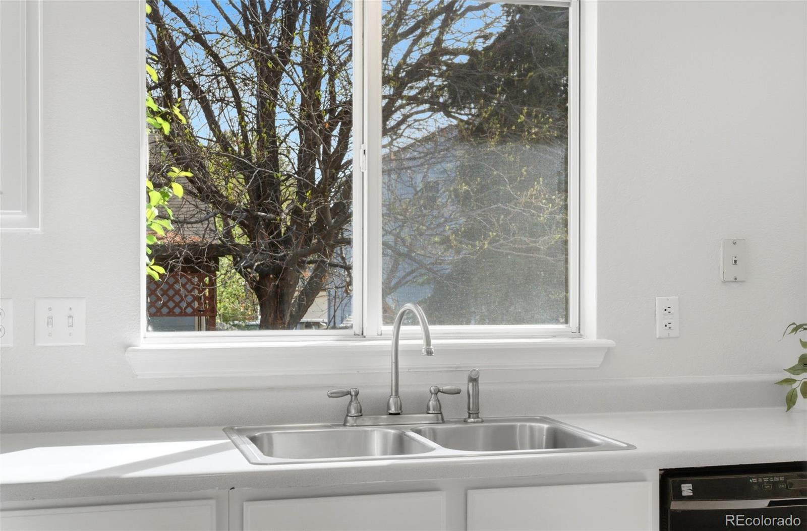 2164 South Waco Street Aurora, CO 80013 - Photo 22 of 50 a bathroom with a sink and a window