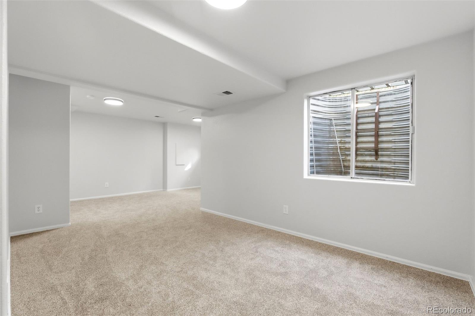 2164 South Waco Street Aurora, CO 80013 - Photo 45 of 50 a view of an empty room with a window