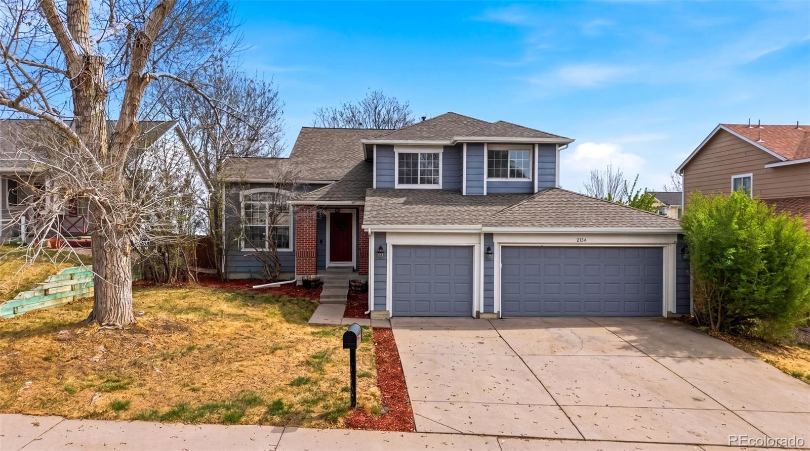 2164 South Waco Street Aurora, CO 80013 - Photo 5 of 50 front view of a house with a yard