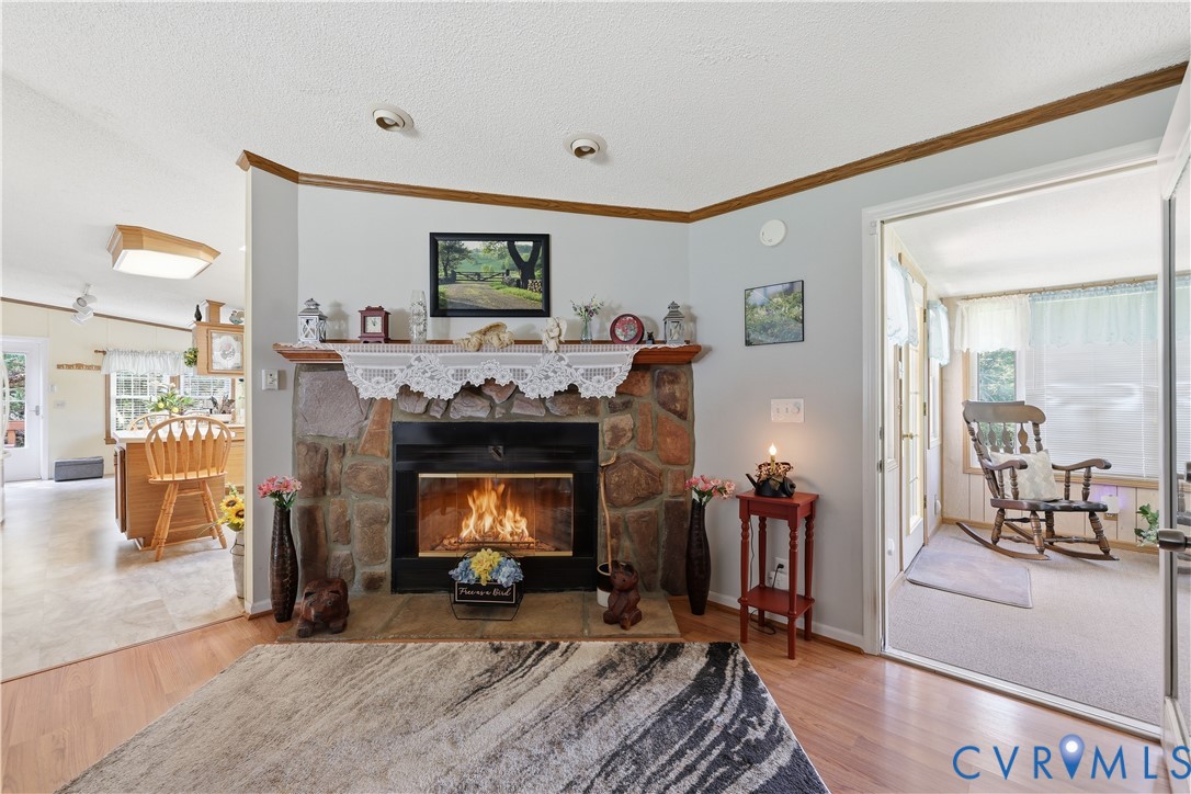 967 Ampthill Road Cartersville, VA 23027 - Photo 25 of 43 Stone fireplace with a wood mantel