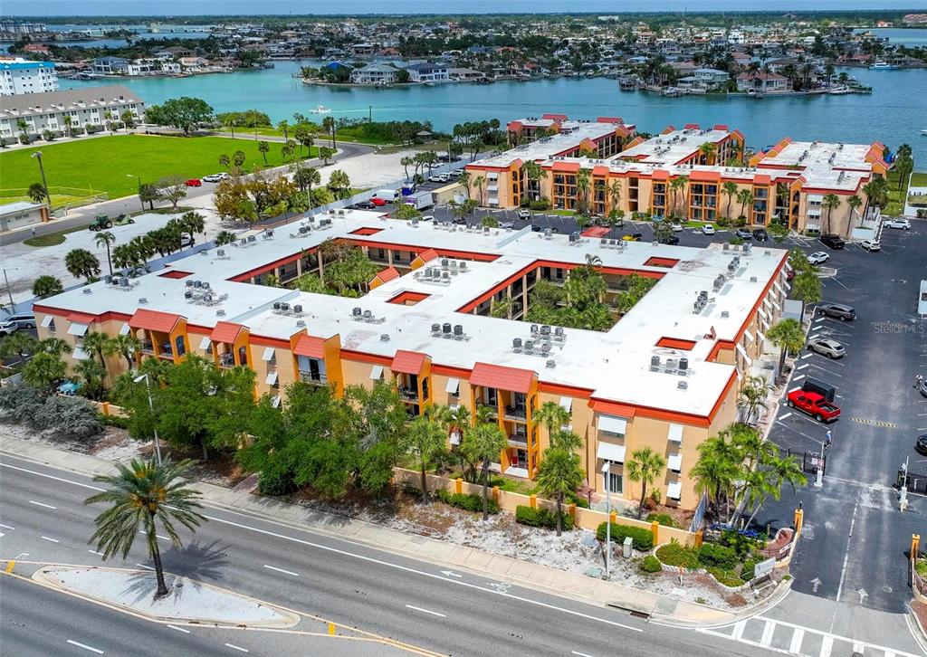 an aerial view of a houses with outdoor space and lake view