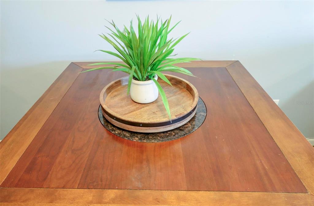 8911 Blind Pass Road, Unit 321 St. Pete Beach, FL 33706 - Photo 12 of 55 a vase of flowers sitting on a table