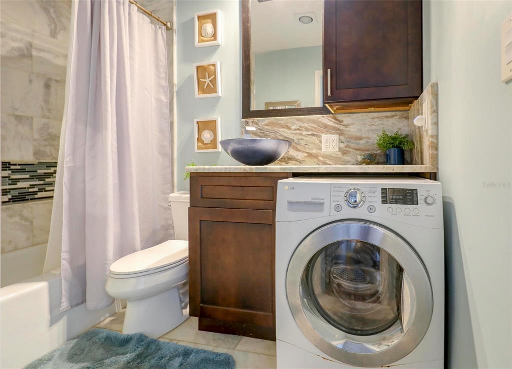 8911 Blind Pass Road, Unit 321 St. Pete Beach, FL 33706 - Photo 20 of 55 a bathroom with a toilet and a sink