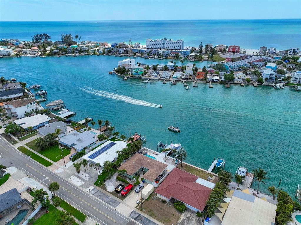 8911 Blind Pass Road, Unit 321 St. Pete Beach, FL 33706 - Photo 3 of 55 an aerial view of a houses with a lake view