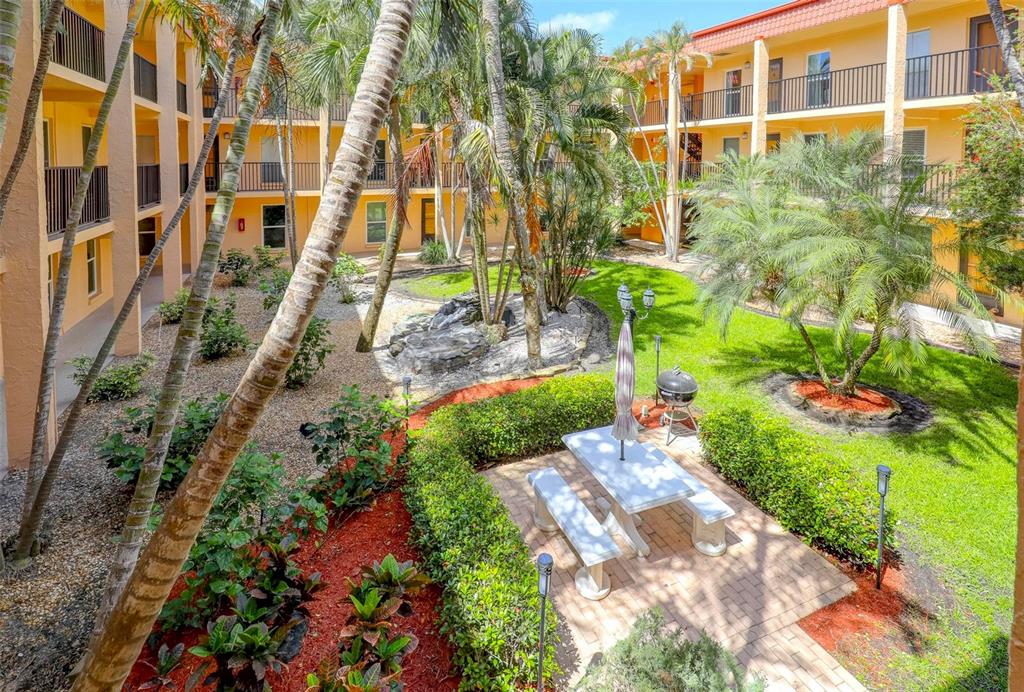8911 Blind Pass Road, Unit 321 St. Pete Beach, FL 33706 - Photo 4 of 55 a view of a back yard of the house