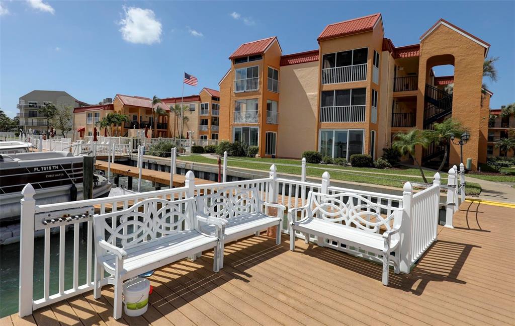 8911 Blind Pass Road, Unit 321 St. Pete Beach, FL 33706 - Photo 45 of 55 a view of a chairs setting in the terrace