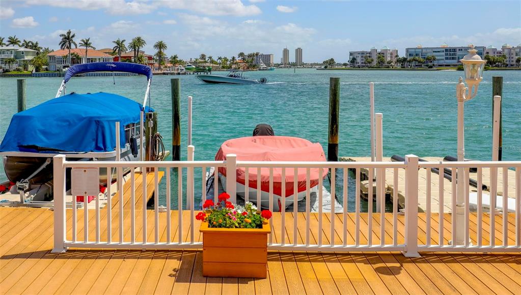 8911 Blind Pass Road, Unit 321 St. Pete Beach, FL 33706 - Photo 46 of 55 a view of a chairs on the roof deck