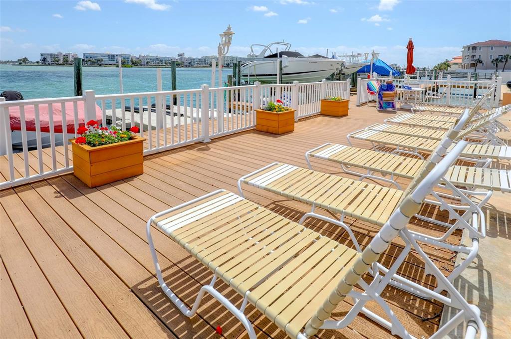 8911 Blind Pass Road, Unit 321 St. Pete Beach, FL 33706 - Photo 49 of 55 a view of roof deck with seating space and city view