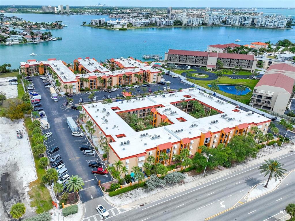 8911 Blind Pass Road, Unit 321 St. Pete Beach, FL 33706 - Photo 54 of 55 an aerial view of a houses with outdoor space and lake view
