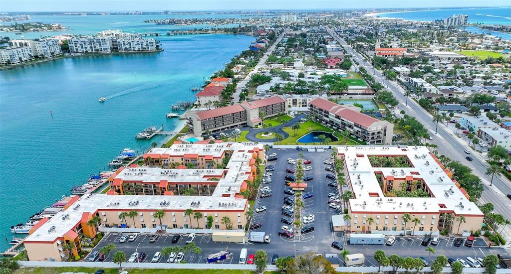 8911 Blind Pass Road, Unit 321 St. Pete Beach, FL 33706 - Photo 55 of 55 an aerial view of residential building and lake