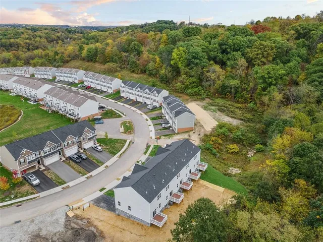 an aerial view of a house with a garden