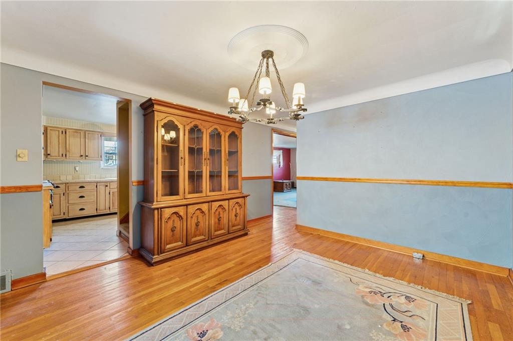 1237 Circle Drive Pittsburgh, PA 15221 - Photo 17 of 40 a view of an empty room with wooden floor