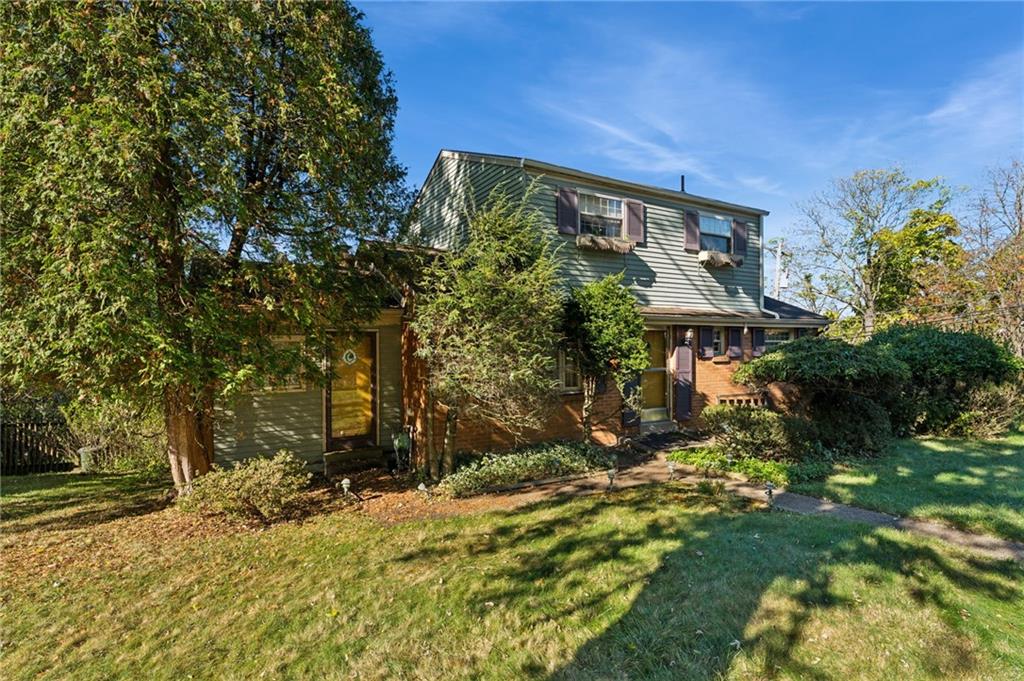 1237 Circle Drive Pittsburgh, PA 15221 - Photo 2 of 40 a backyard of a house with a large tree