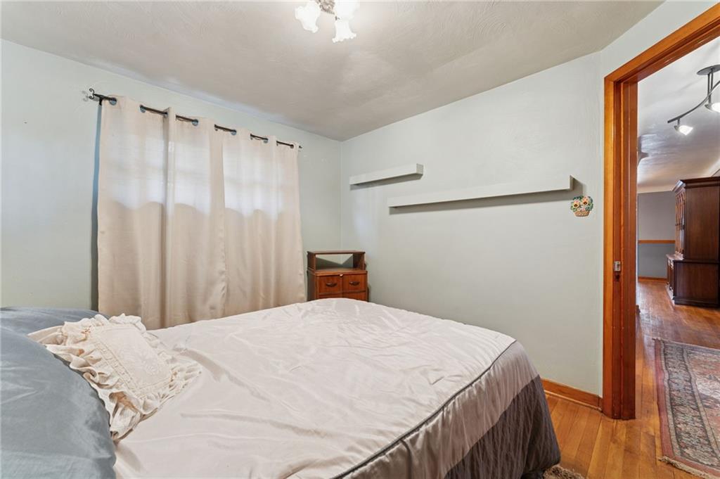 1237 Circle Drive Pittsburgh, PA 15221 - Photo 26 of 40 a bedroom with a bed and a window