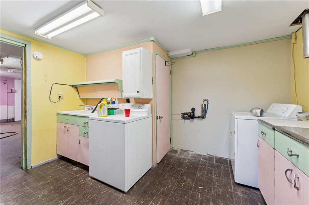 1237 Circle Drive Pittsburgh, PA 15221 - Photo 38 of 40 a storage room with wooden floor washer and dryer