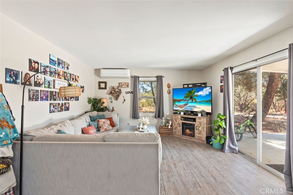 38855 Howard Road Anza, CA 92539 - Photo 2 of 54 a living room with furniture and a flat screen tv