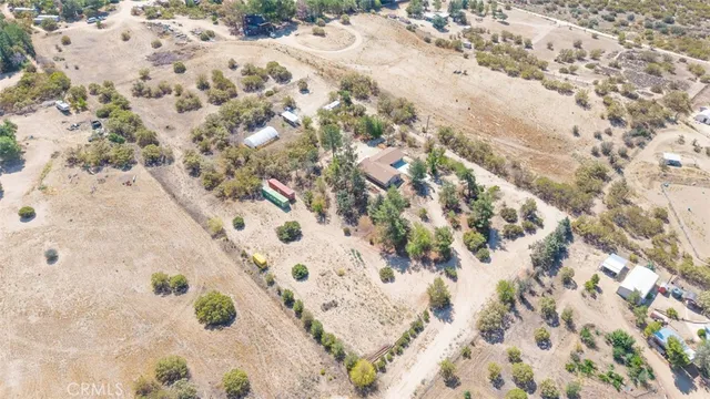a bird view of house with yard