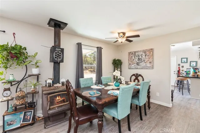 a view of a dining room with furniture and a chandelier