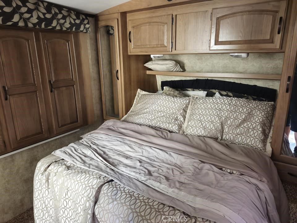 38855 Howard Road Anza, CA 92539 - Photo 54 of 54 a bed sitting in a bedroom and wooden floor