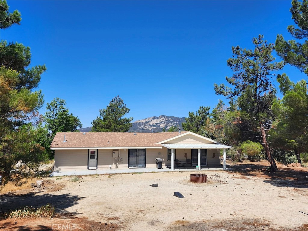 38855 Howard Road Anza, CA 92539 - Photo 6 of 54 a front view of a house with a yard