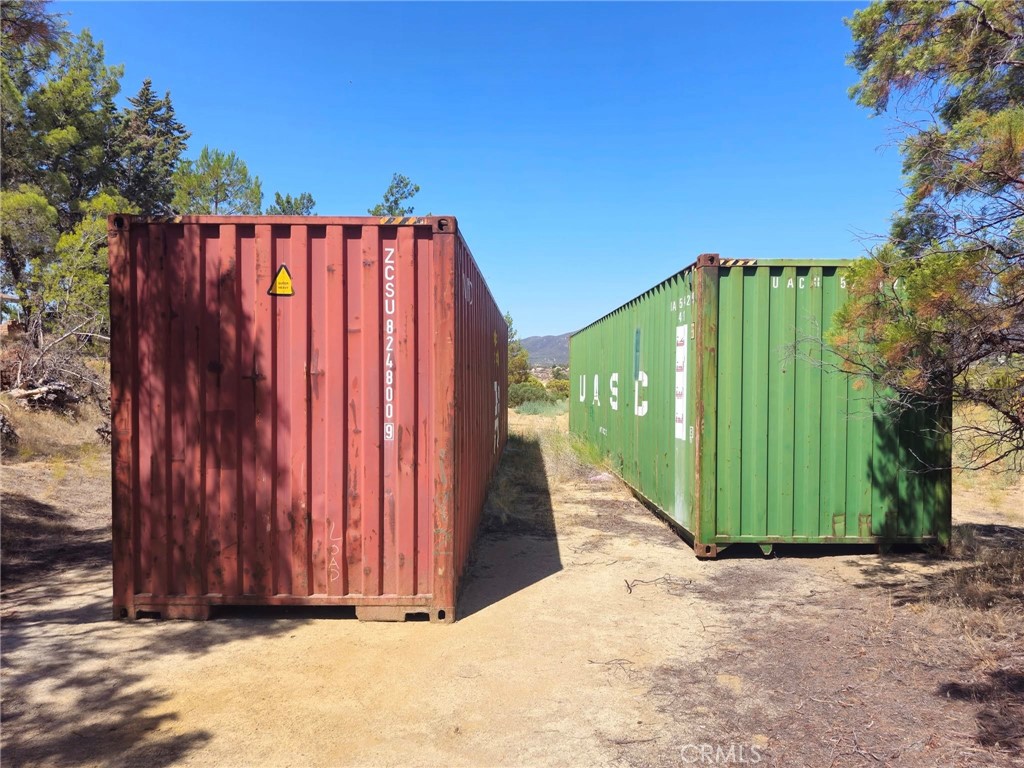 38855 Howard Road Anza, CA 92539 - Photo 9 of 54 a view of a wooden fence with a house in the background
