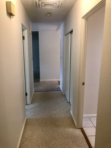 a room with a desk and a window