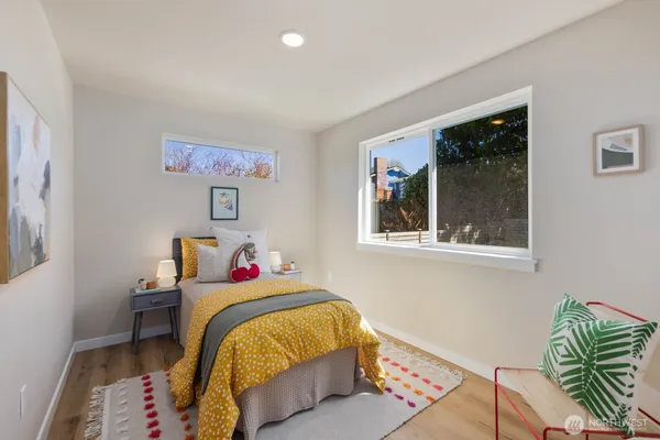 a bedroom with bed and a window