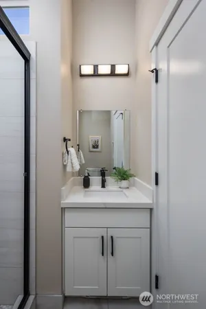 a bathroom with a sink and a mirror