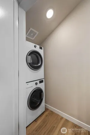 a view of a hallway with washer and dryer