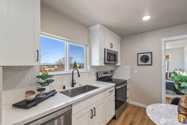 a kitchen with a sink and cabinets
