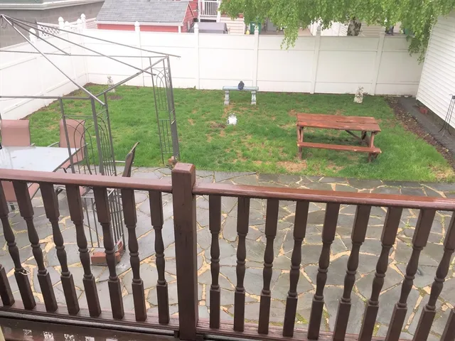 a view of a yard with furniture