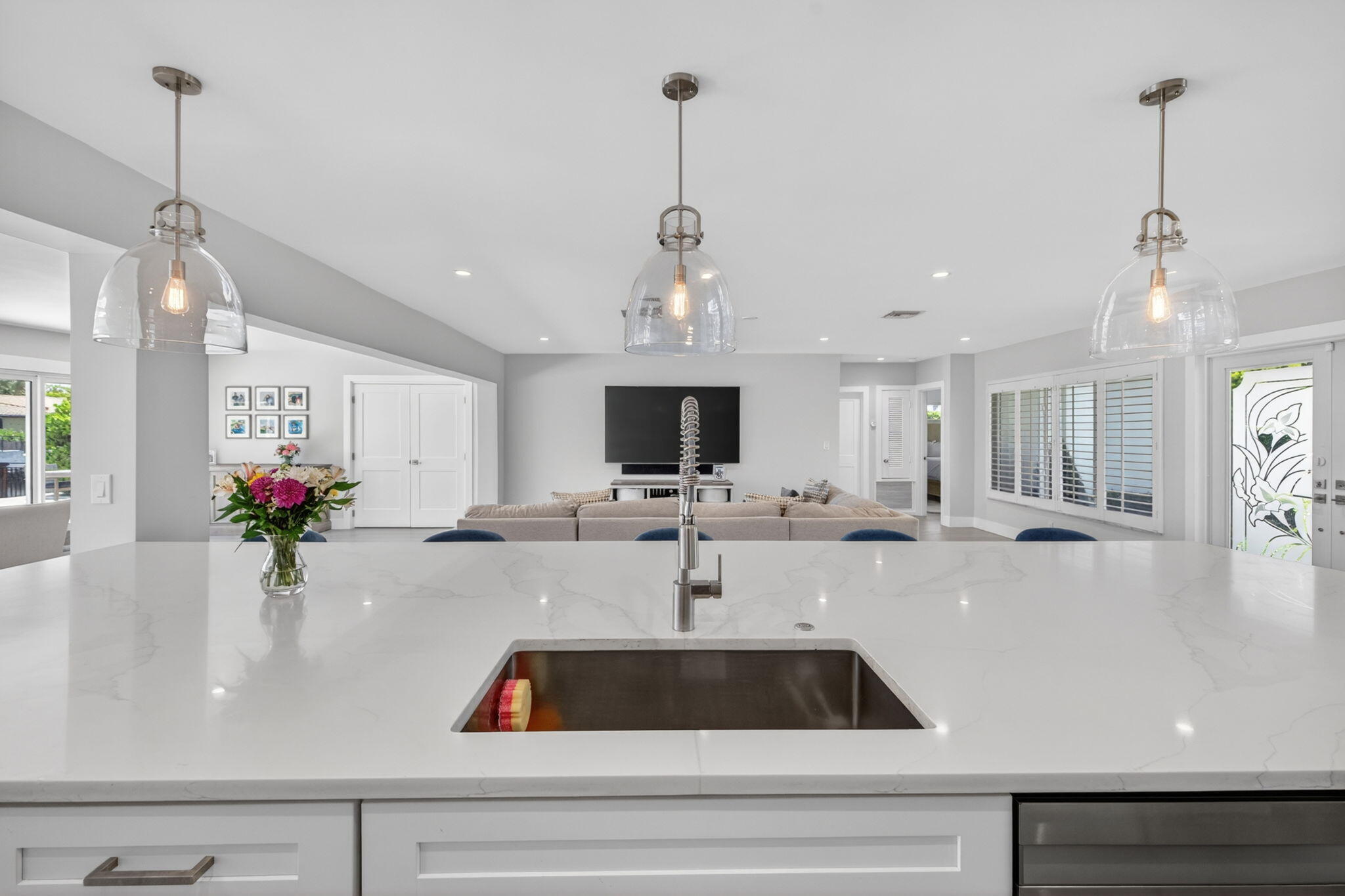 4460 Northeast 26th Avenue Lighthouse Point, FL 33064 - Photo 11 of 55 a kitchen with kitchen island a counter top space a sink and cabinets