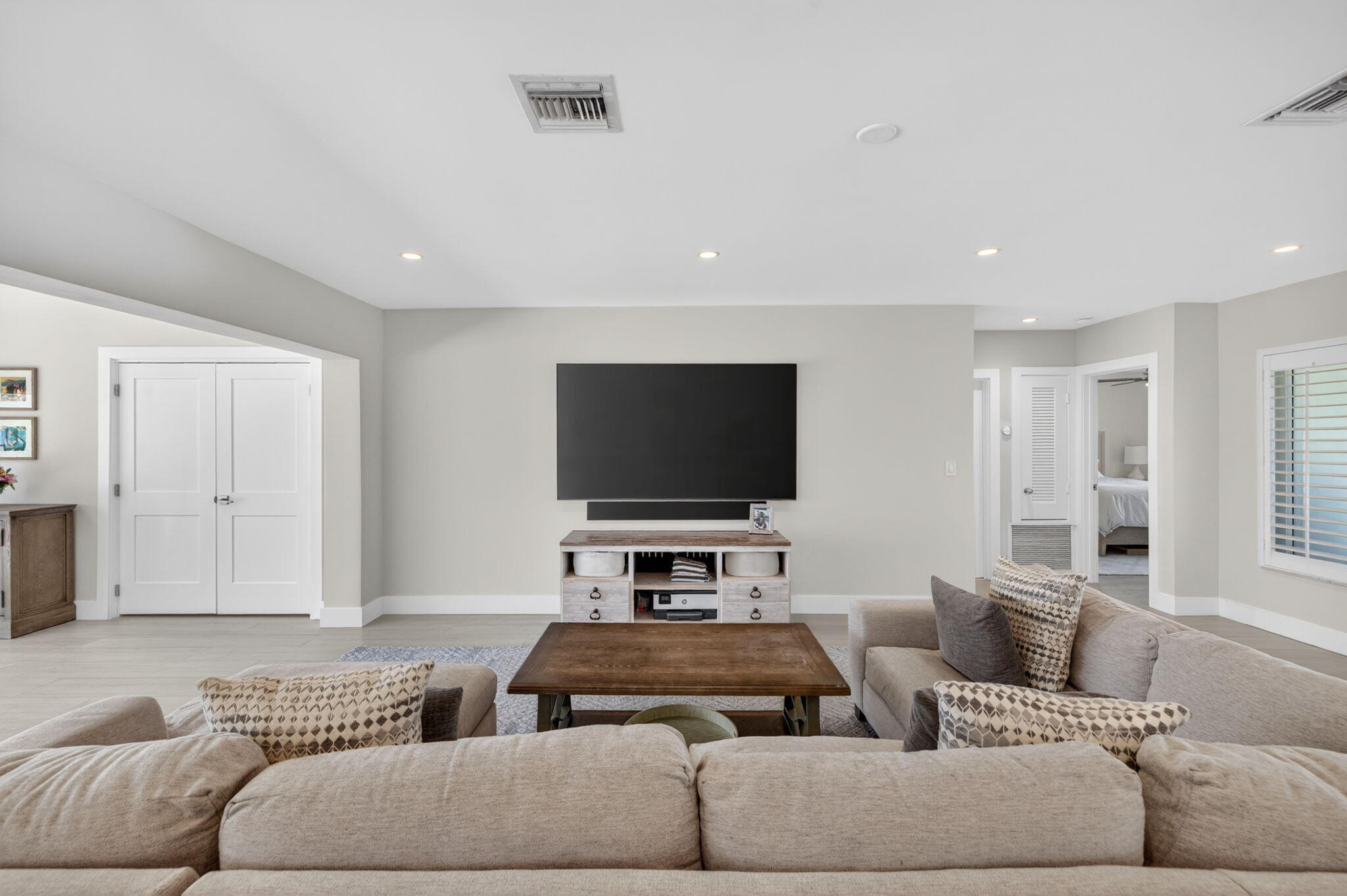 4460 Northeast 26th Avenue Lighthouse Point, FL 33064 - Photo 14 of 55 a living room with furniture and a flat screen tv