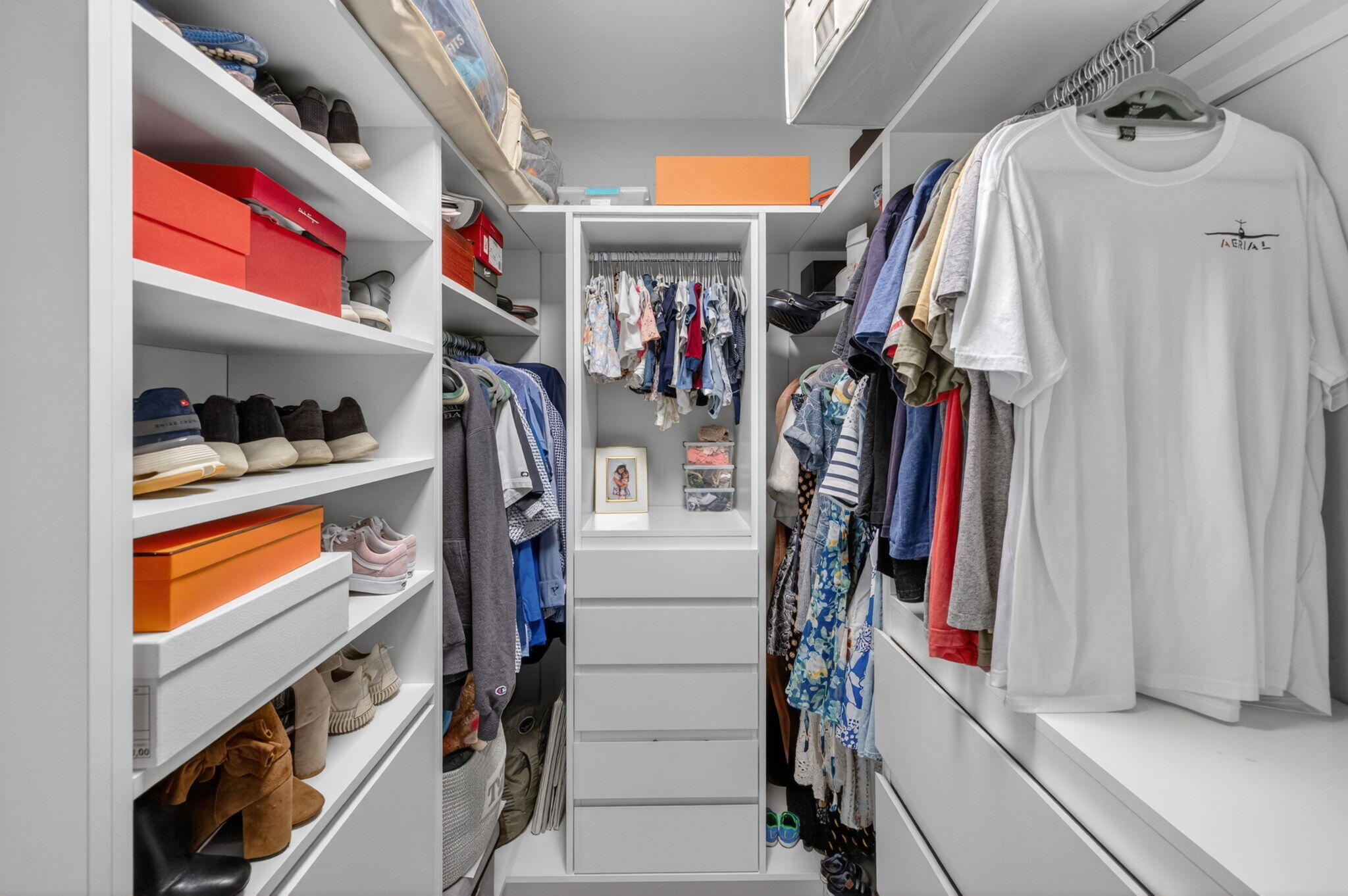 4460 Northeast 26th Avenue Lighthouse Point, FL 33064 - Photo 26 of 55 a view of walk in closet with clothes and shoes