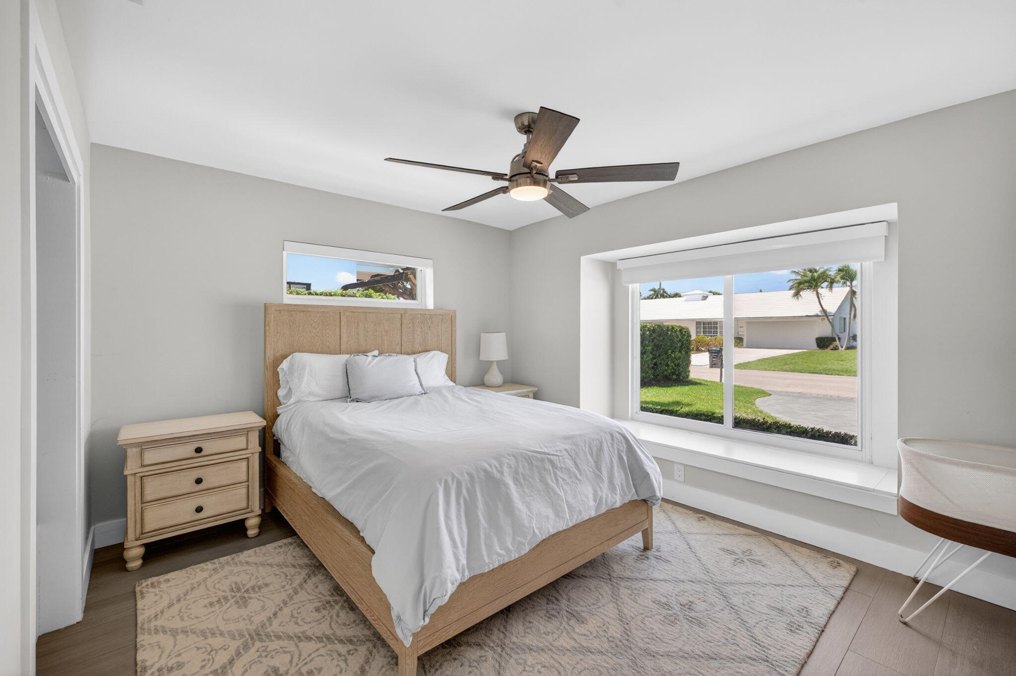 4460 Northeast 26th Avenue Lighthouse Point, FL 33064 - Photo 27 of 55 a bedroom with a bed and a large window