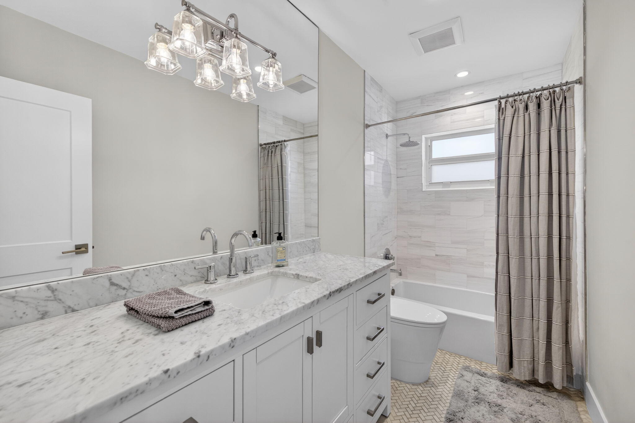 4460 Northeast 26th Avenue Lighthouse Point, FL 33064 - Photo 28 of 55 a bathroom with a granite countertop sink a large mirror and a shower