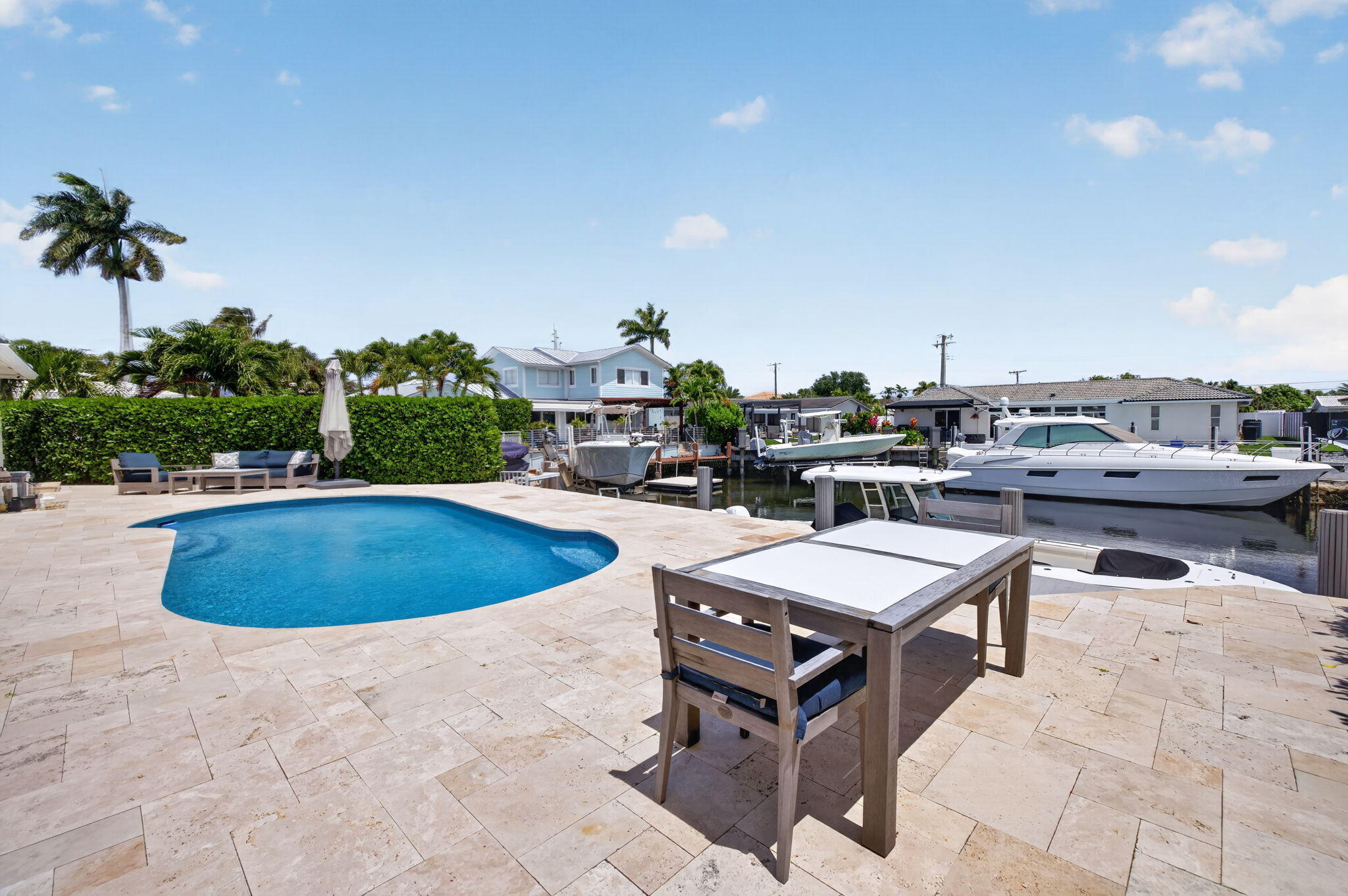 4460 Northeast 26th Avenue Lighthouse Point, FL 33064 - Photo 34 of 55 a view of a swimming pool with outdoor seating