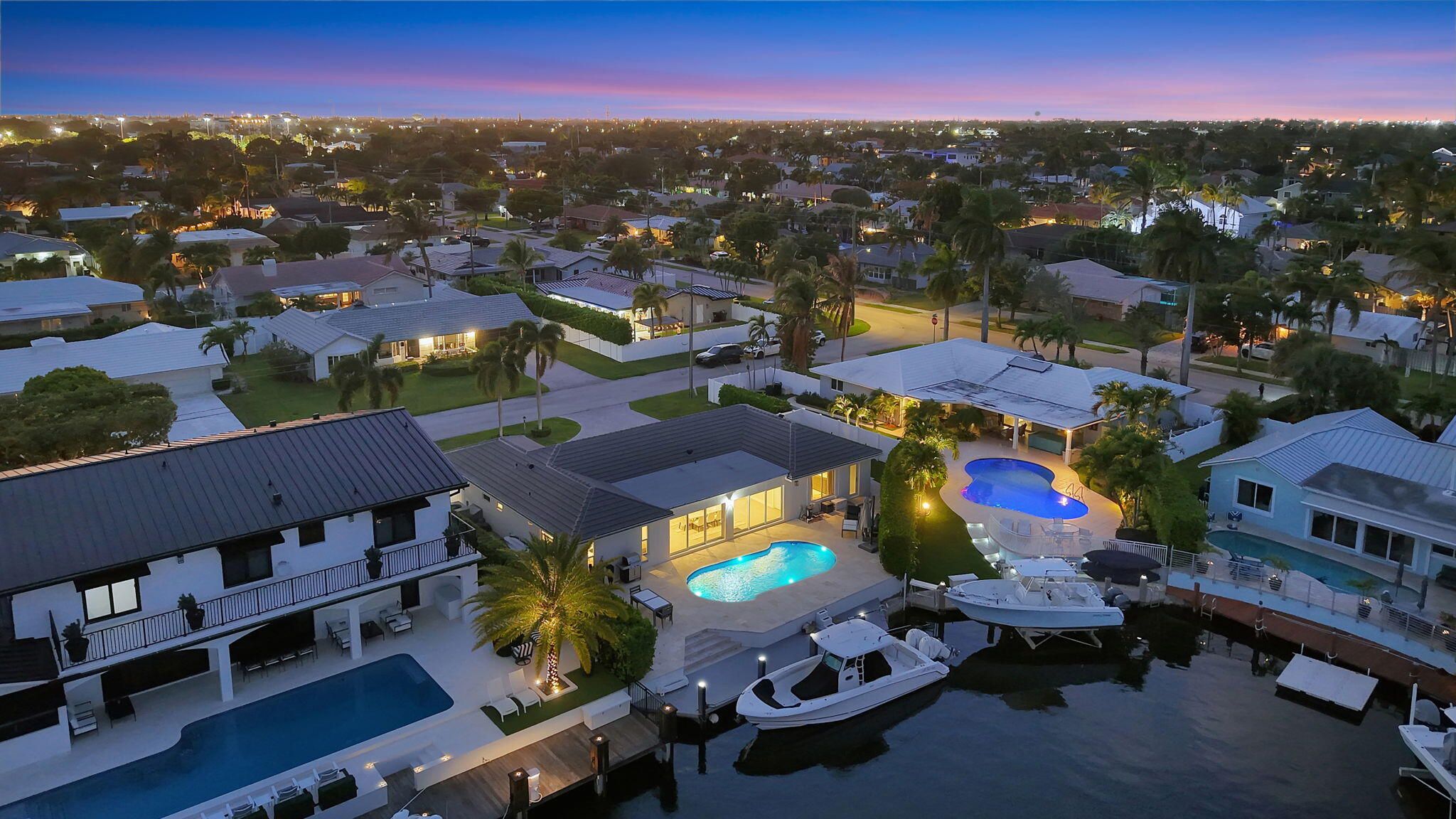 4460 Northeast 26th Avenue Lighthouse Point, FL 33064 - Photo 51 of 55 an aerial view of a houses with a swimming pool