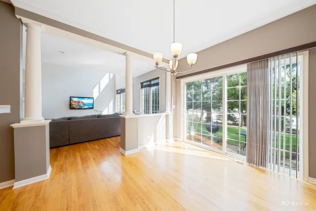 a view of a living room and kitchen with a large window
