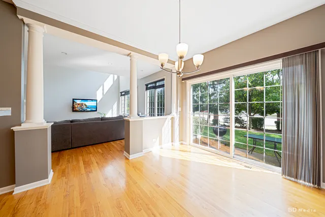 a view of a living room and kitchen with a large window