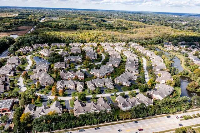 an aerial view of residential houses with outdoor space