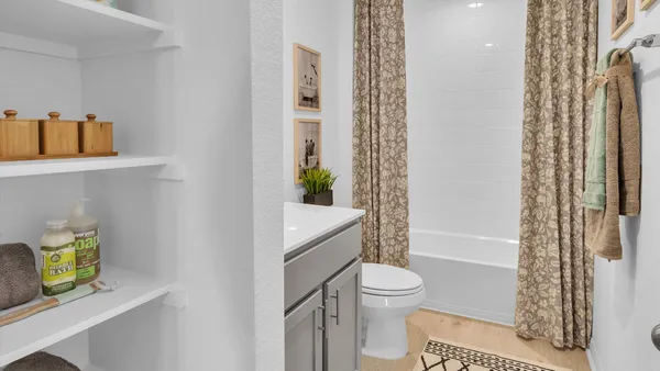 a bedroom that has a bed and a table in it