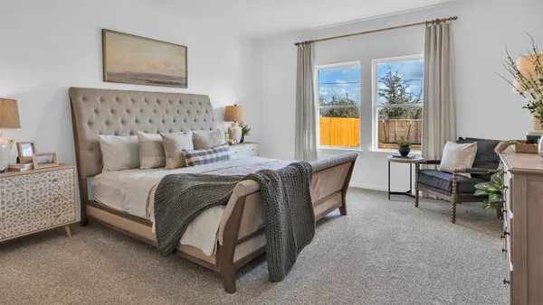 a bedroom with a bed and a couch