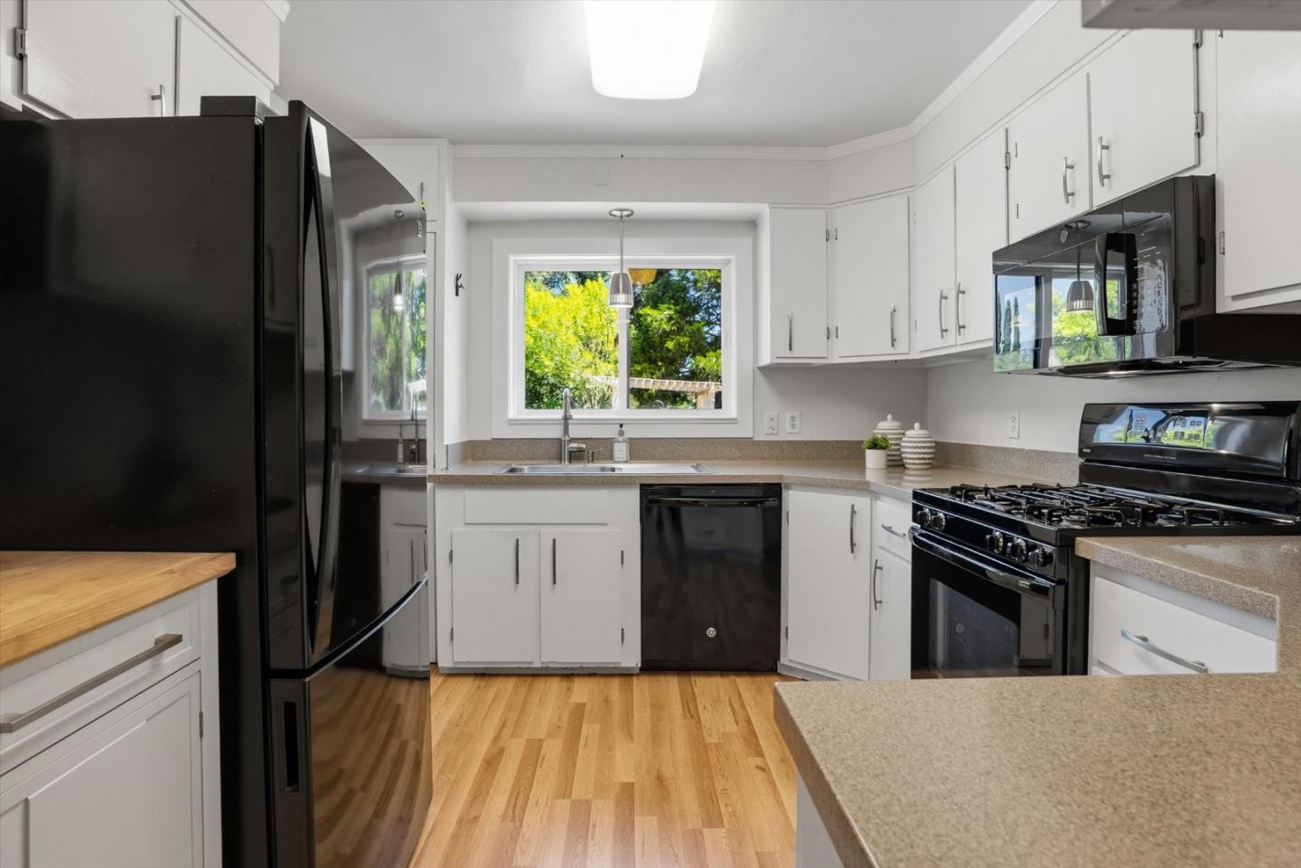 16899 Kennedy Road Los Gatos, CA 95032 - Photo 16 of 61 a kitchen with a sink stove and refrigerator