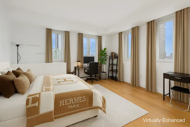 a picture of a bathroom with a white wall