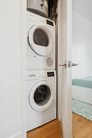 a kitchen with kitchen island stainless steel appliances a sink and cabinets