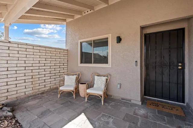 a kitchen with stainless steel appliances granite countertop a stove a kitchen island a dining table and chairs with wooden floor