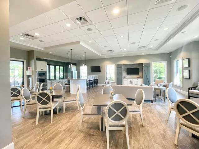 a view of swimming pool with outdoor seating