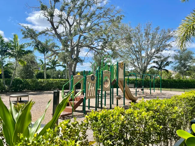 a view of swimming pool with outdoor seating and plants